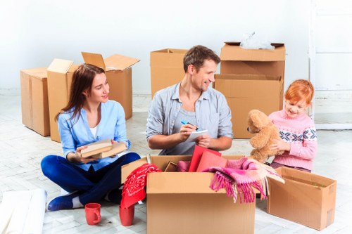 Packed boxes and furniture prepared for flat removals in Brockley