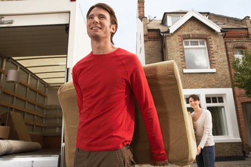 Experienced packers preparing fragile items for relocation